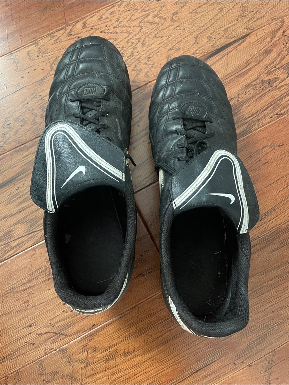 Nike Men’s Black Athletic Football Cleats with White Accents